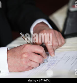 Man completeing a questionnaire Stock Photo