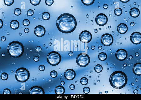 Water drops on blue background Stock Photo
