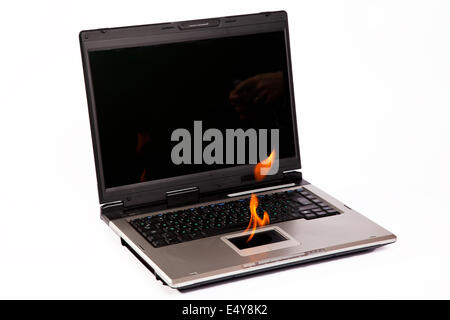 Laptop with flame on touchpad Stock Photo