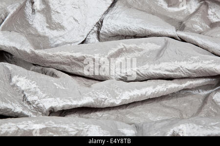 Silver wrinkled fabric taffeta background Stock Photo