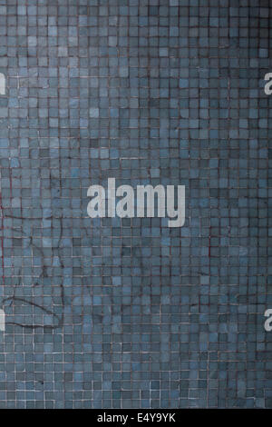 Blue wall with tiles and graffiti texture Stock Photo