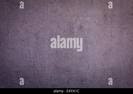Concrete texture with uneven surface in purple hues Stock Photo