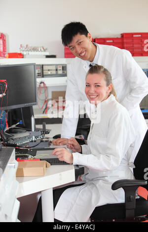 Two technicians at work in a laboratory Stock Photo