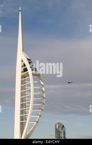 Dakota aircraft flying past Portsmouth Spinnaker tower D-Day 70 anniversary , Hampshire, England, UK Stock Photo