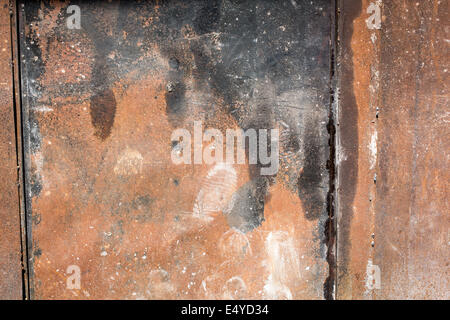Dirty and rusty metal wall with scratches and marks Stock Photo