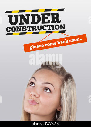 Young girl looking at contruction icons Stock Photo