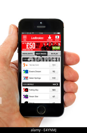 Ladbrokes online betting app on an Apple iPhone 5S Stock Photo