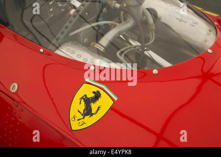 Ferrari prancing horse logo on a red racing car Stock Photo