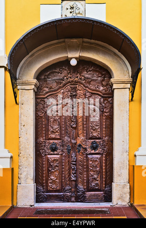 Old carved wooden church door. Religious abstract. Stock Photo