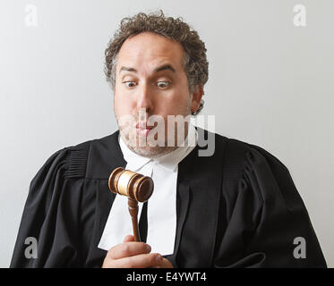 Blowing on the gavel Stock Photo