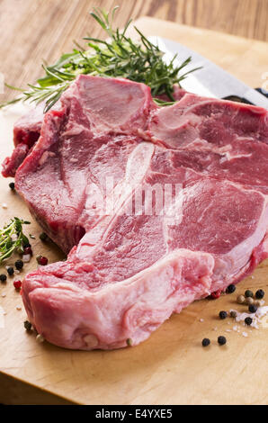 t-bone steak with herbs and pepper Stock Photo