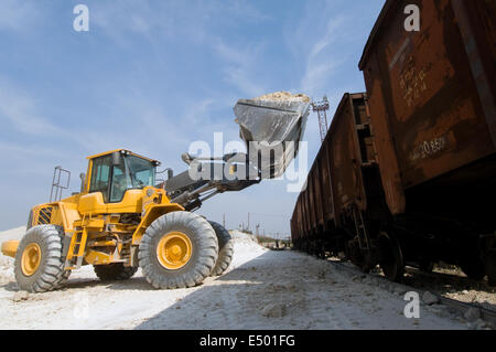 Loader loads the wagon train Stock Photo