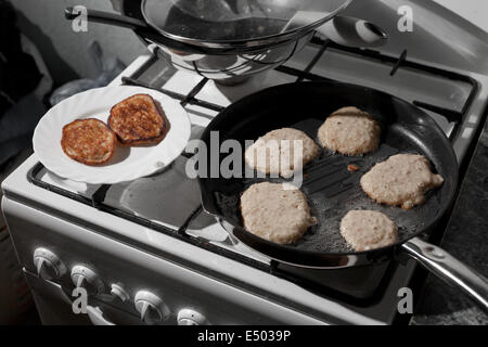 Pans on the stove in a kitchen. Stock Photo