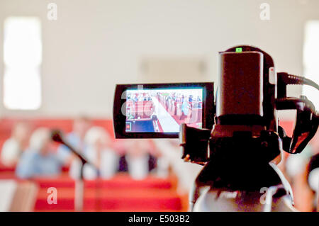 Cameraman recording video of a marriage Stock Photo