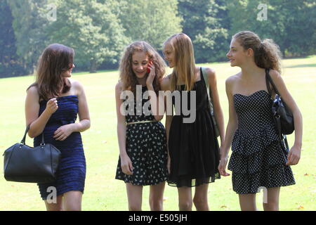 Teenage girls walking through the park Stock Photo