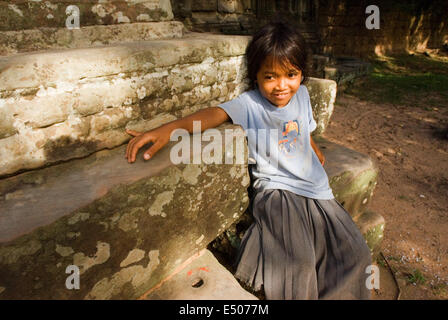 Children playing inside the Preah Khan Temple. Preah Khan, meaning 'sacred sword,’ is a huge, highly explorable monastic complex Stock Photo
