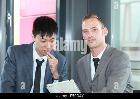 Two businessmen in a serious discussion Stock Photo