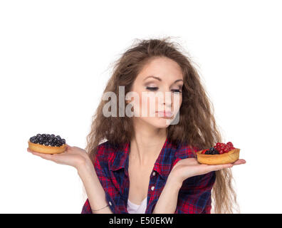 Difficult choice between two cakes Stock Photo