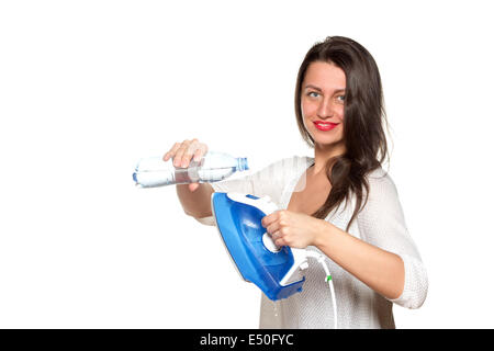the girl fills the iron in with water Stock Photo