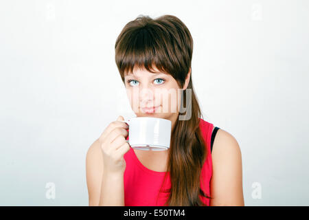 girl with a big white mug Stock Photo
