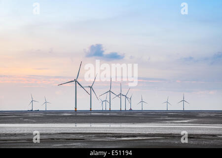 wind turbines in mud flat Stock Photo
