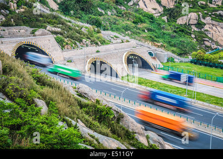 tunnel with container trucks Stock Photo