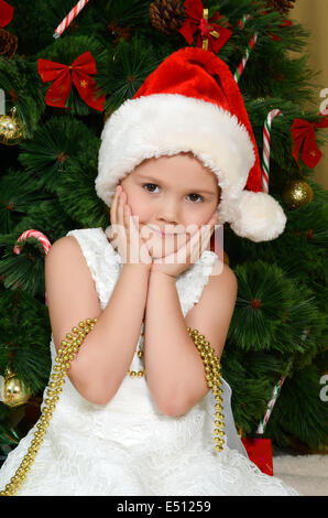 The little girl at christmas fur-tree Stock Photo