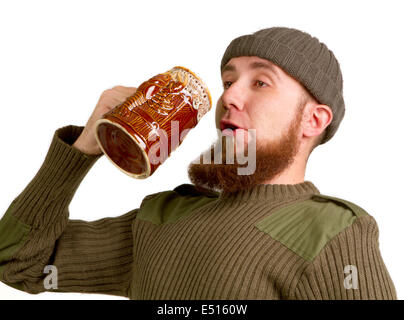 bearded guy drinking beer from the glass Stock Photo