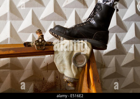 black army boots standing on gas mask Stock Photo