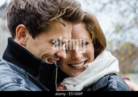 Happy Couple Embracing Outdoors Stock Photo