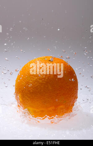 Orange fruits and Splashing water Stock Photo