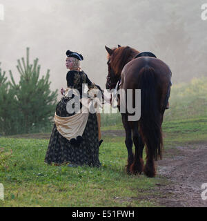 Woman in dress royal baroque riding Stock Photo - Alamy