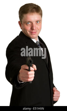 The man in a suit aims from a pistol Stock Photo