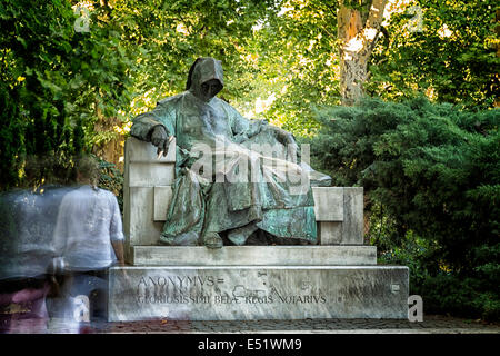 the Statue of Anonymous is in front of the Vajdahunyad Castle in the City Park, Budapest. Stock Photo