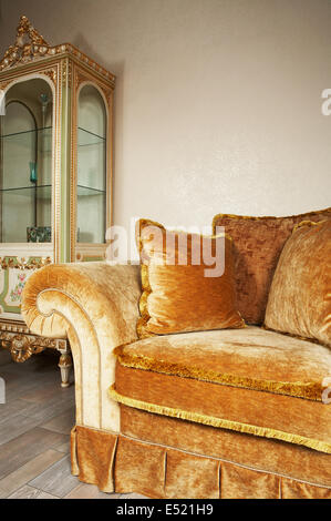 Orange sofa with pillows Stock Photo