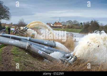 Floodwater is pumped from the Somerset Levels into the River Parrett near Moorlands UK Stock Photo