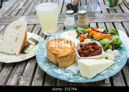 A tasty  'Ploughman's Lunch' of Pork Pie Cheese Boiled Egg Salad Pickle and bread and butter in a café in North Yorkshire Stock Photo