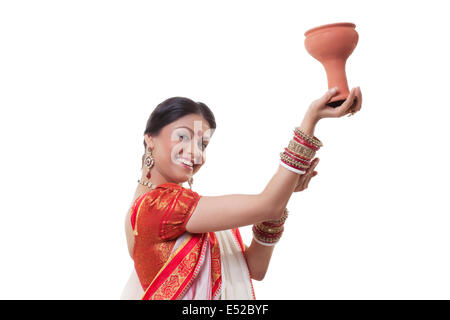 Portrait of Bengali woman doing Dhunuchi dance Stock Photo