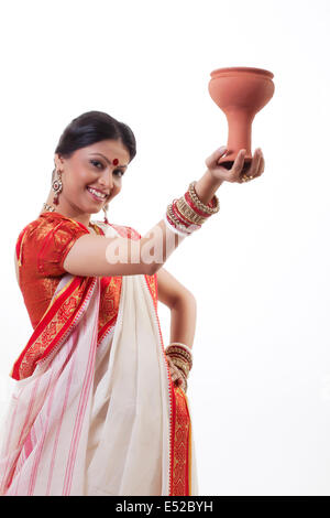 Portrait of Bengali woman doing Dhunuchi dance Stock Photo