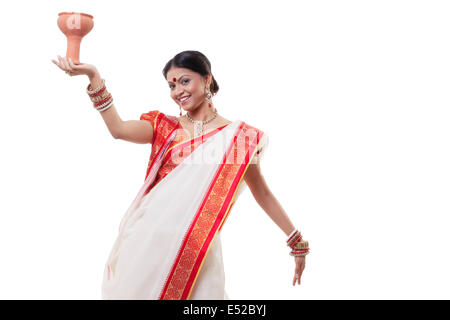 Portrait of Bengali woman doing Dhunuchi dance Stock Photo