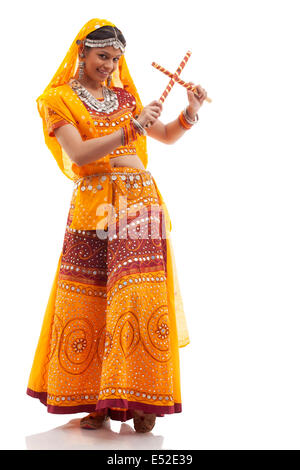 Woman performing Dandiya Raas at Navratri Stock Photo - Alamy