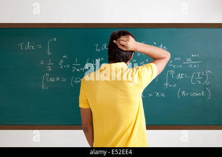 College student trying to solve a maths equation Stock Photo - Alamy