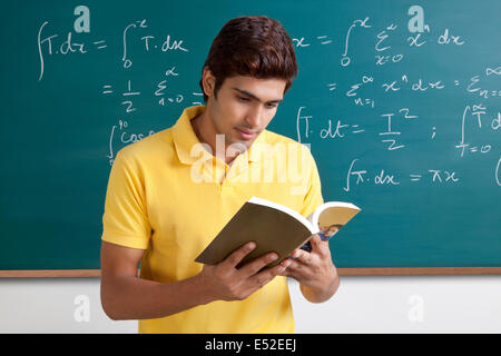 College student reading a book Stock Photo