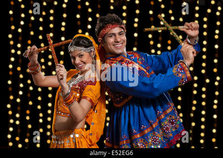 Women performing dandiya Stock Photo - Alamy