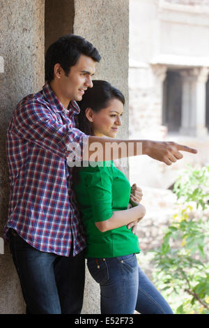 Man pointing something out to girlfriend Stock Photo