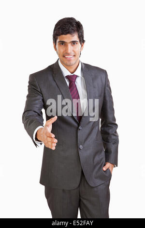 Portrait of business executive extending hand out Stock Photo