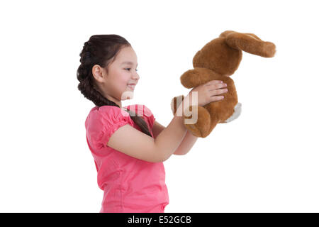 Little girl holding a toy rabbit Stock Photo