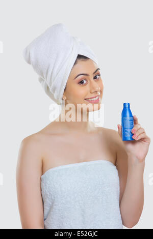 Portrait of beautiful woman wrapped in a towel sitting on bed Stock ...
