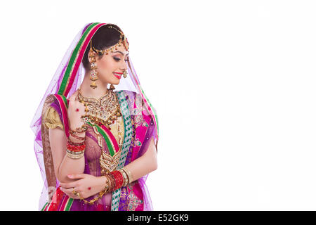 Traditional Indian bride smiling over white background Stock Photo