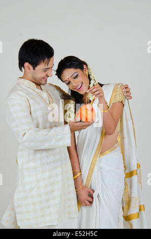 South Indian man showing wife jewelery Stock Photo - Alamy